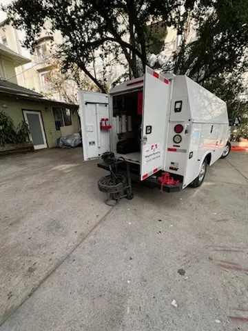 Magnet Plumbing service vehicle on-site for Grease Trap Cleaning in Carrollwood